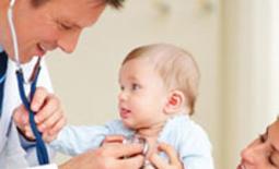 pediatrician checks baby